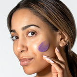 Woman Applying ReSURFACE Skin Polish by Alastin Skincare to cheek