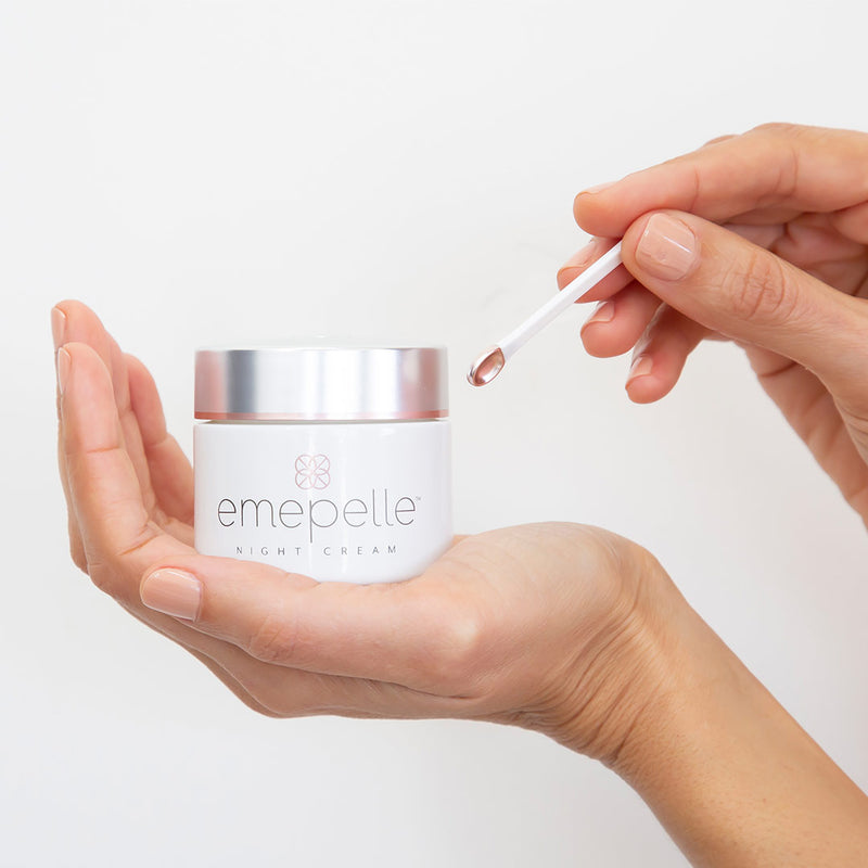 Emepelle Night Cream and application on display in womans hands